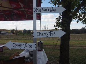 Signpost reads - Fine Food and Wine, Cherry Pie and Cherry Juice.