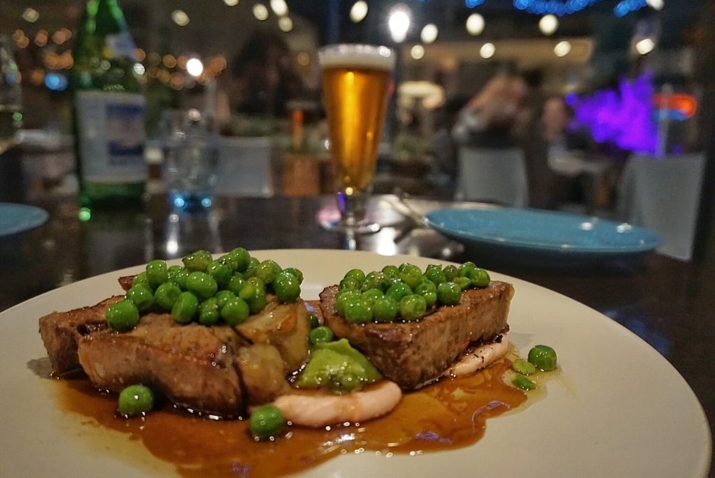Succulent Lamb - Twice cooked shoulder, green pea puree, taramasalata, buttered green peas, red wine jus