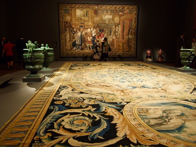 Large detailed floor carpet, and wall tapestry.