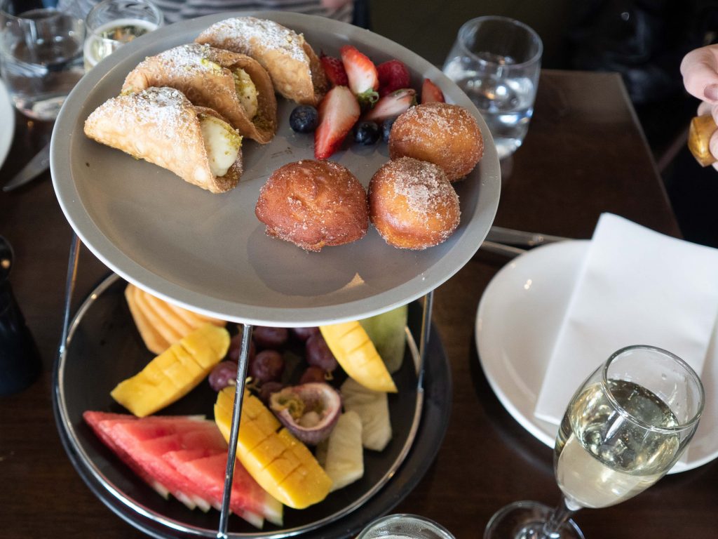 A degustation of fresh fruits accompanied by Italian pastries will satisfy the sweet cravings